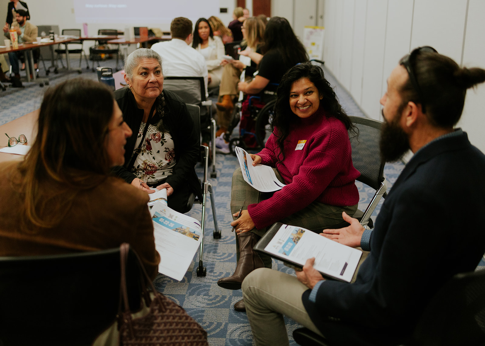 Nonprofit professionals smiling during a community event
