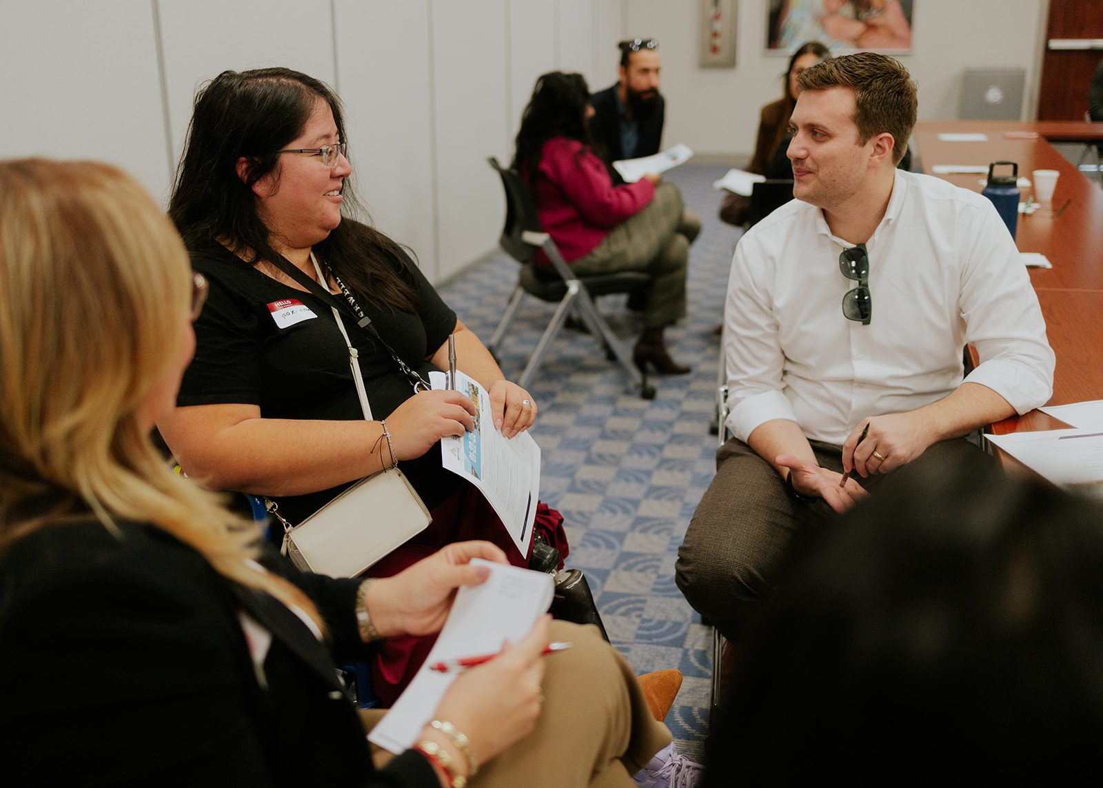 Community members in conversation at a small group gathering