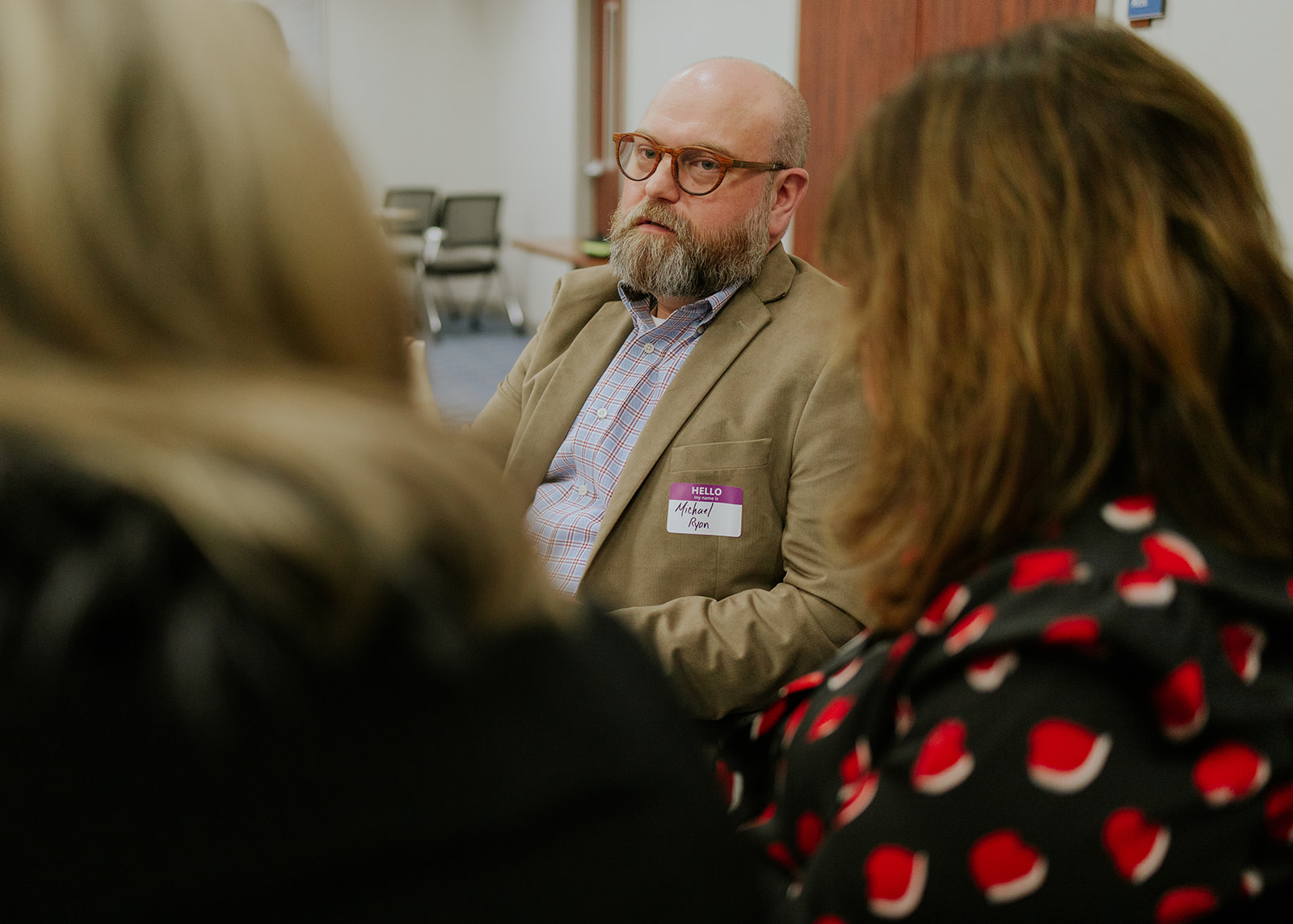 A participant listening during a small group discussion