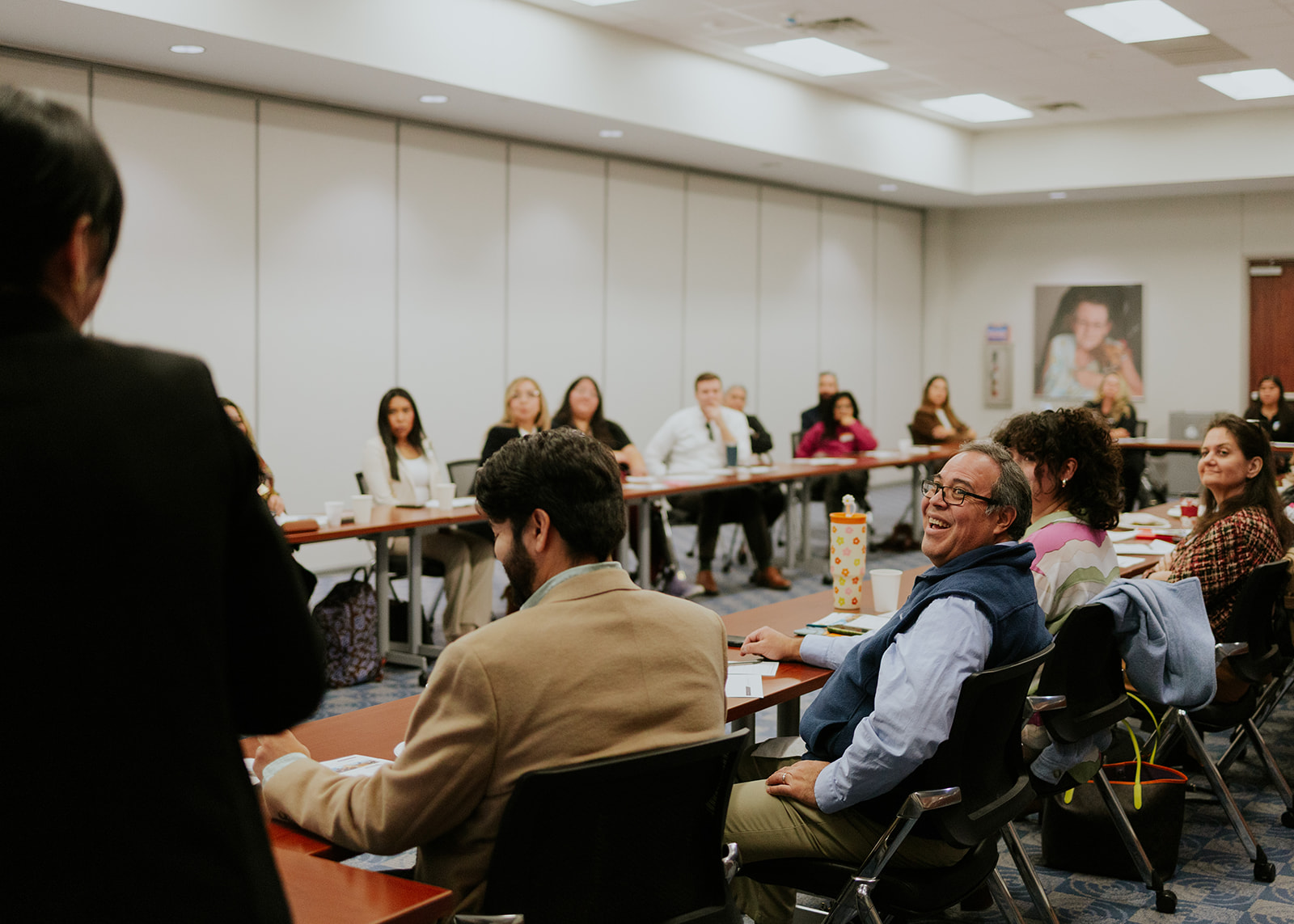 Community members engaged during a Roots to Leadership meeting